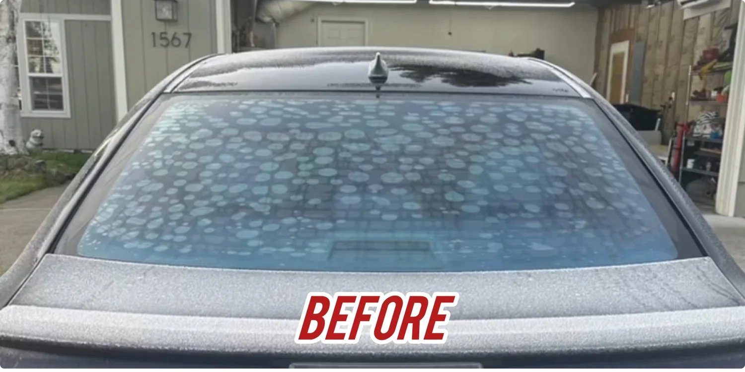 Vehicle window with old failing tint before removal