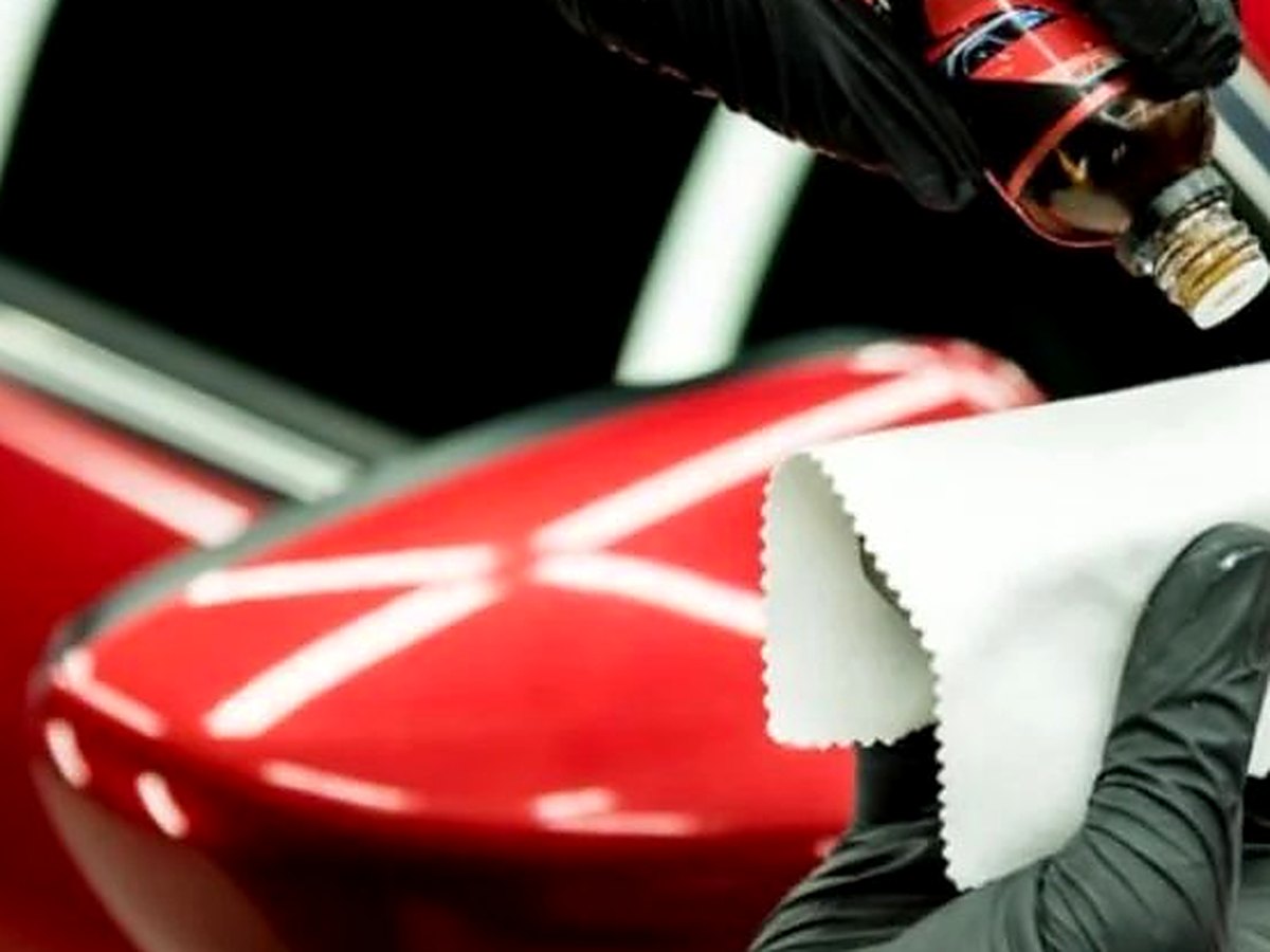 Ceramic coating product being applied to a glossy vehicle panel at Rosie's Window Tint