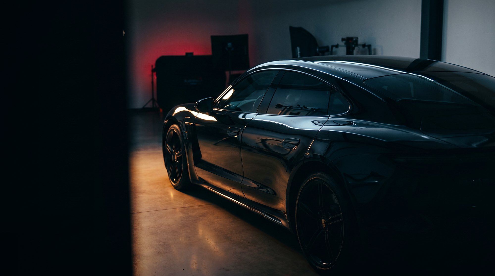 Cinematic black performance vehicle showcasing premium automotive window tint