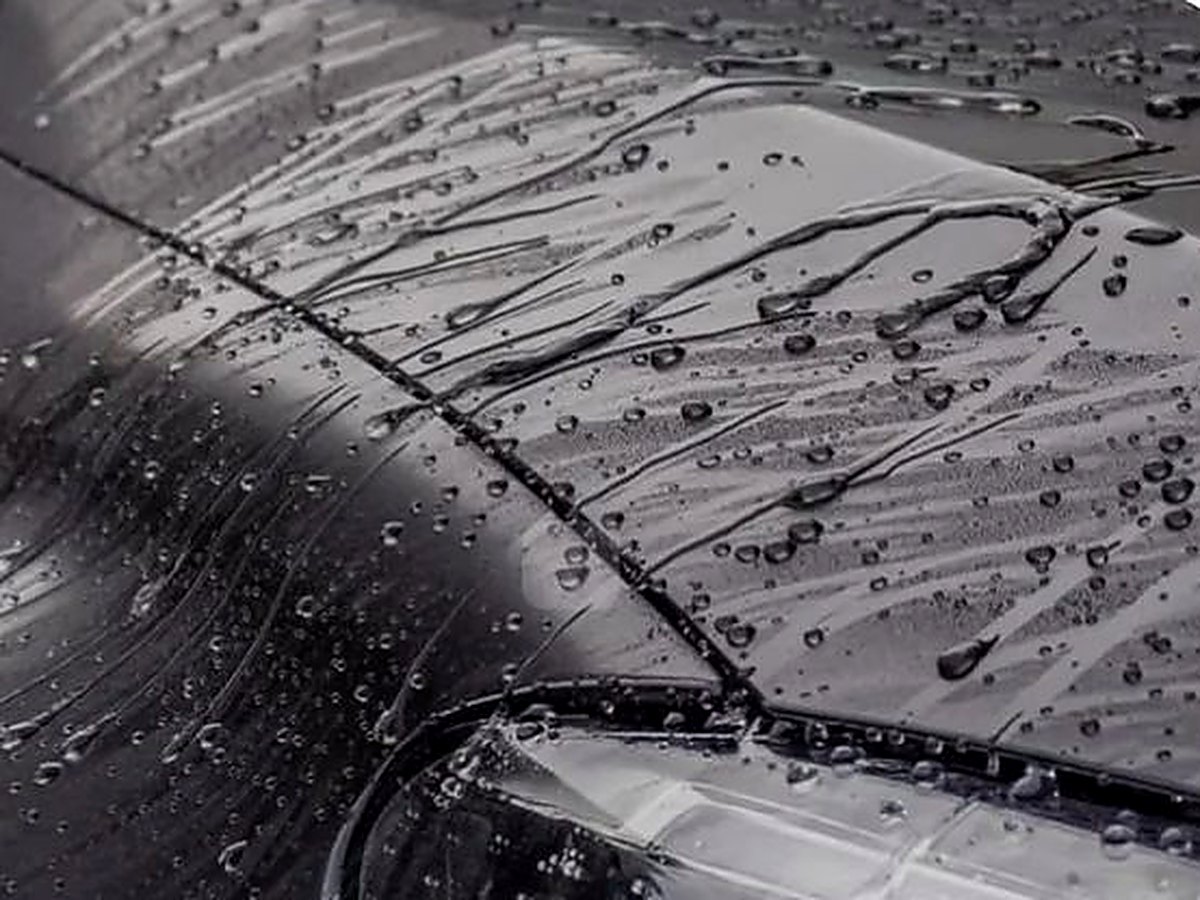 Water beading on a ceramic-coated black hood